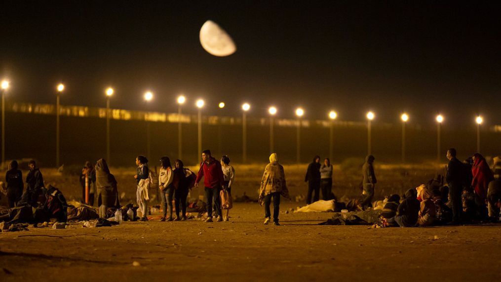 FILE - Migrants arrive at a gate in the border fence after crossing from Ciudad Juarez, Mexico into El Paso, Texas, in the early hours of Thursday, May 11, 2023. (AP Photo/Andres Leighton, File)