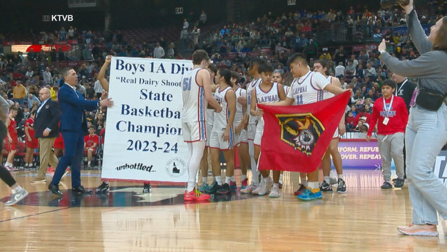 The Wildcats pose with the state banner. Courtesy: KTVB{&nbsp;}{p}{/p}