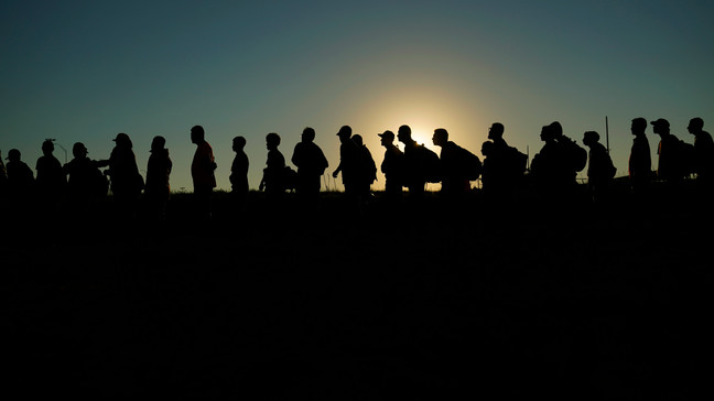 FILE - Migrants who crossed the Rio Grande and entered the U.S. from Mexico are lined up for processing by U.S. Customs and Border Protection, Saturday, Sept. 23, 2023, in Eagle Pass, Texas. (AP Photo/Eric Gay, File)