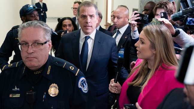 Hunter Biden, President Joe Biden's son, center, leaves a House Oversight Committee hearing as Republicans are taking the first step toward holding him in contempt of Congress, Wednesday, Jan. 10, 2024, on Capitol Hill in Washington.  (AP Photo/Jose Luis Magana)