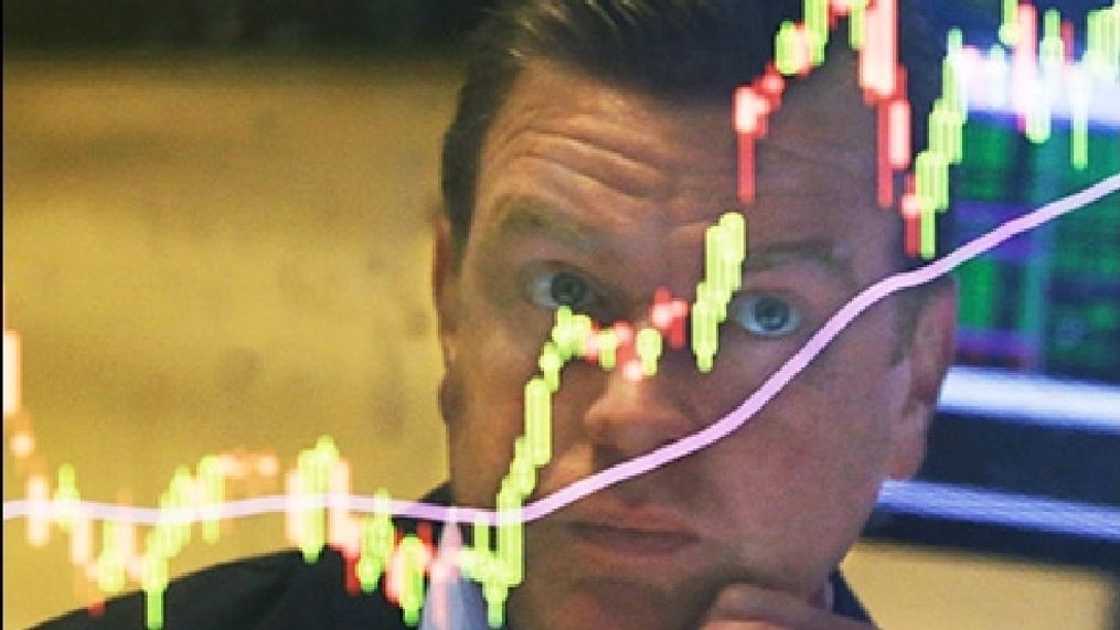 Specialist Michael O'Mara works on the floor of the New York Stock Exchange, Tuesday, Aug. 25, 2015.