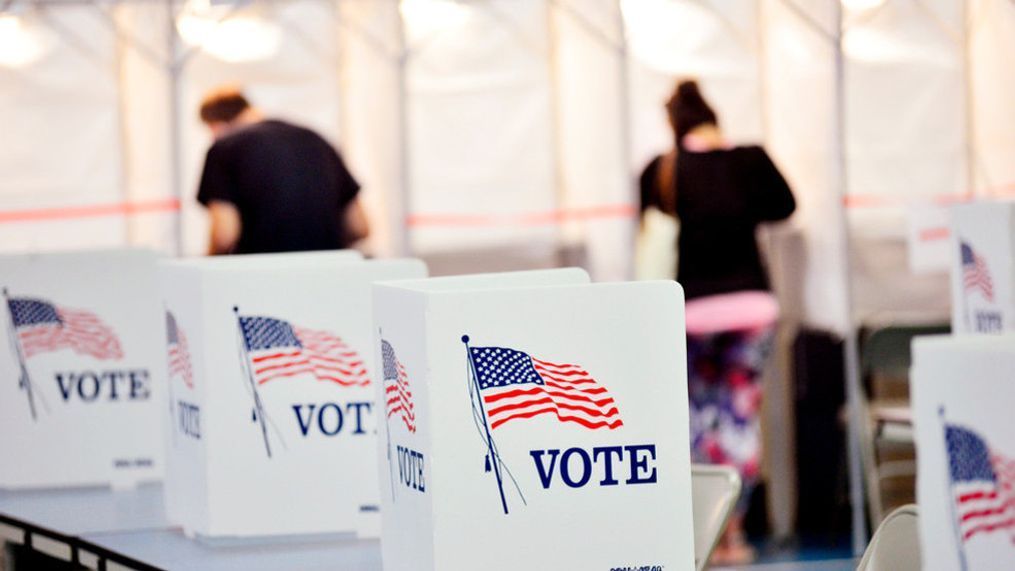 FILE - Voters stand in voting booths in this undated file photo. (AP Photo)