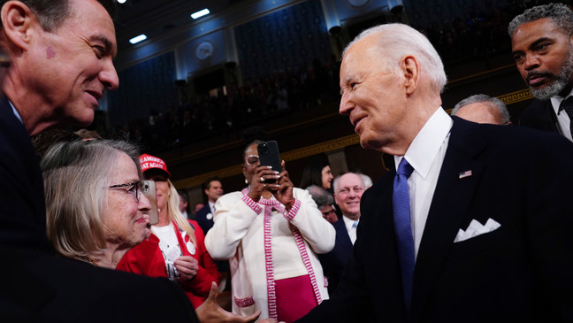 President Joe Biden, right, arrives to deliver the State of the Union address to a joint session of Congress at the Capitol, Thursday, March 7, 2024, in Washington. (Shawn Thew/Pool via AP)