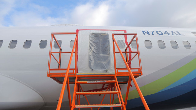 FILE - This photo released by the National Transportation Safety Board shows a gaping hole where the paneled-over door had been at the fuselage plug area of Alaska Airlines Flight 1282, Jan. 7, 2024, in Portland, Oregon. (National Transportation Safety Board via AP, File)